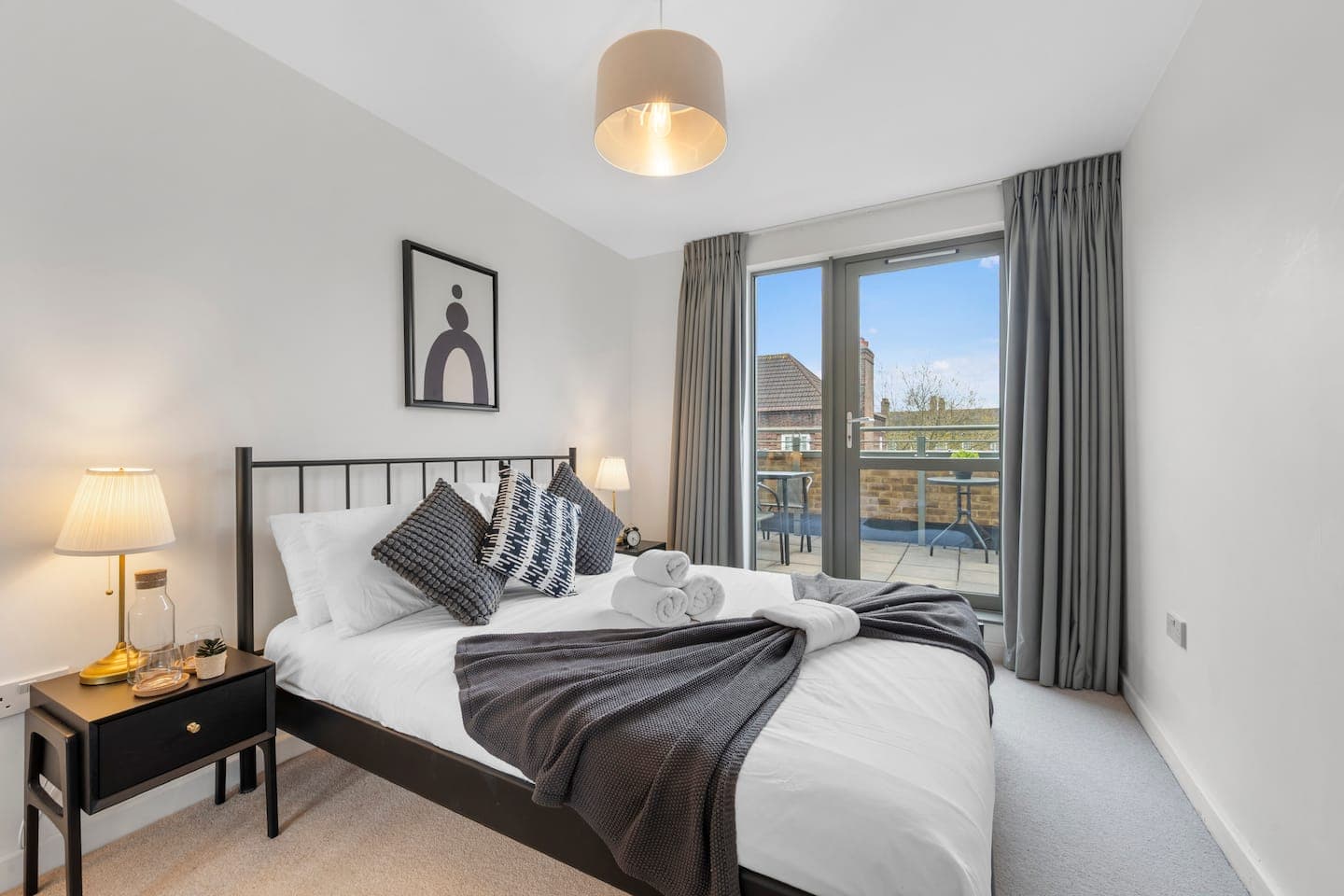 King bedroom with private terrace access and hotel-quality linen